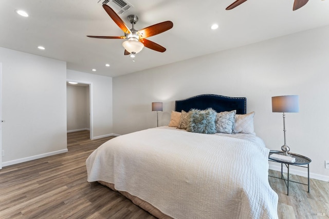 bedroom with baseboards, visible vents, ceiling fan, wood finished floors, and recessed lighting