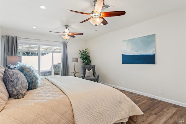 bedroom featuring baseboards, wood finished floors, a ceiling fan, and access to exterior