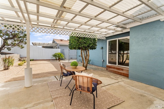 view of patio with fence and a pergola