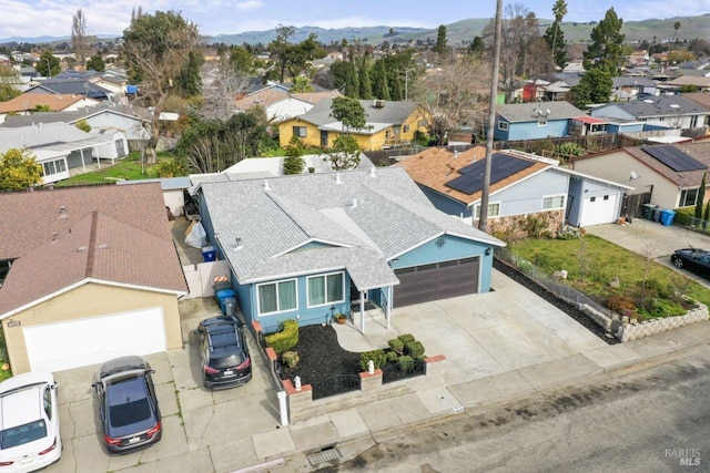 bird's eye view featuring a mountain view and a residential view