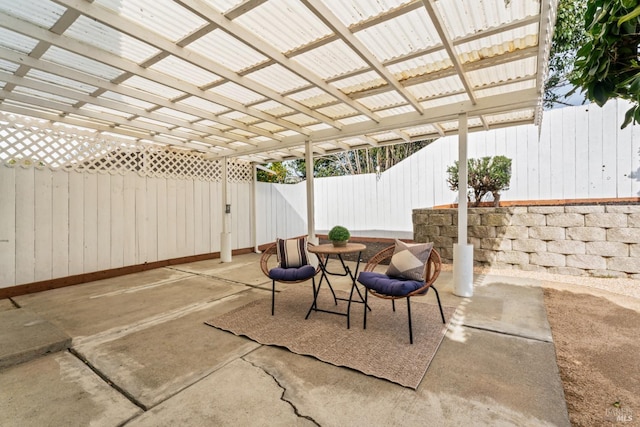 view of patio featuring a fenced backyard and a pergola