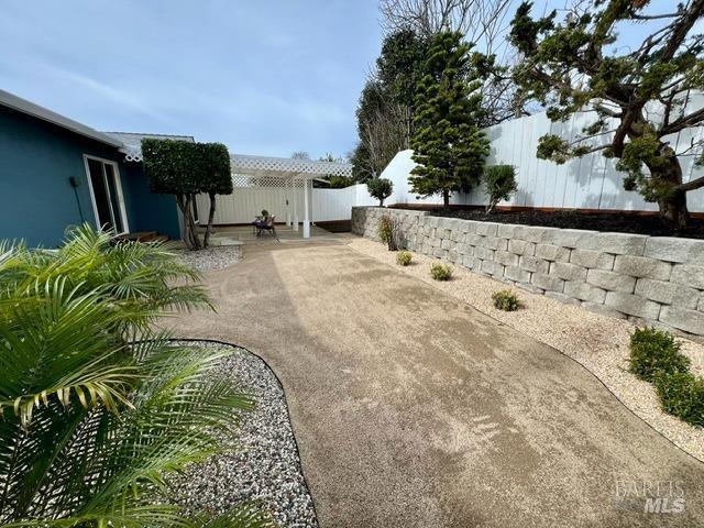 view of yard featuring a patio area and a fenced backyard