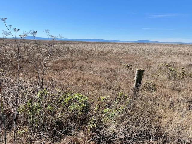 mountain view featuring a rural view