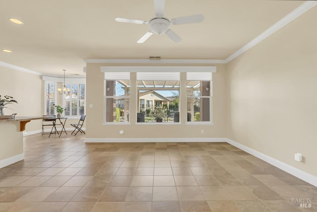 spare room featuring crown molding, baseboards, light tile patterned floors, and visible vents
