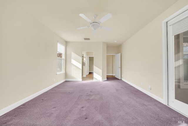 unfurnished bedroom featuring carpet floors, a ceiling fan, baseboards, and visible vents