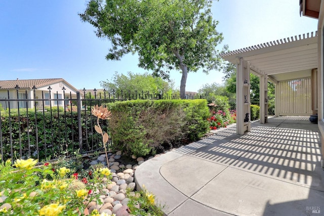 view of patio featuring fence