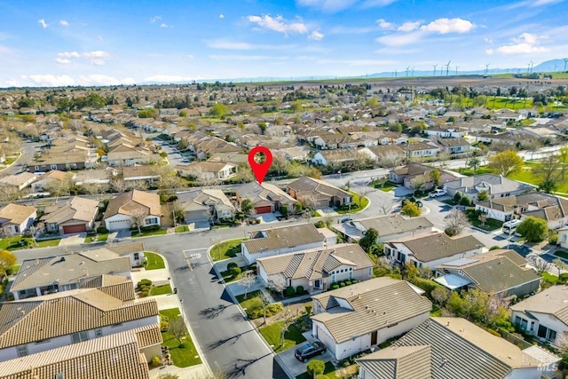 drone / aerial view with a residential view and a mountain view