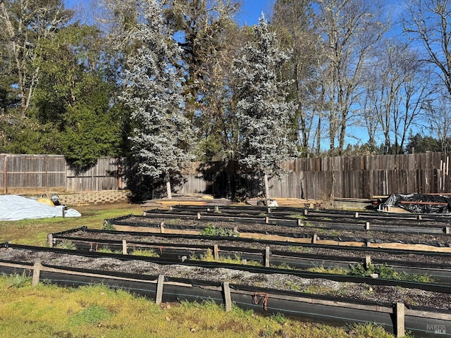 view of yard featuring a garden and fence