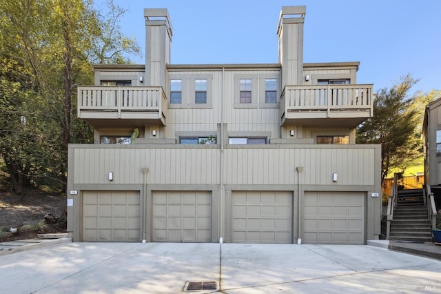 rear view of property featuring a balcony