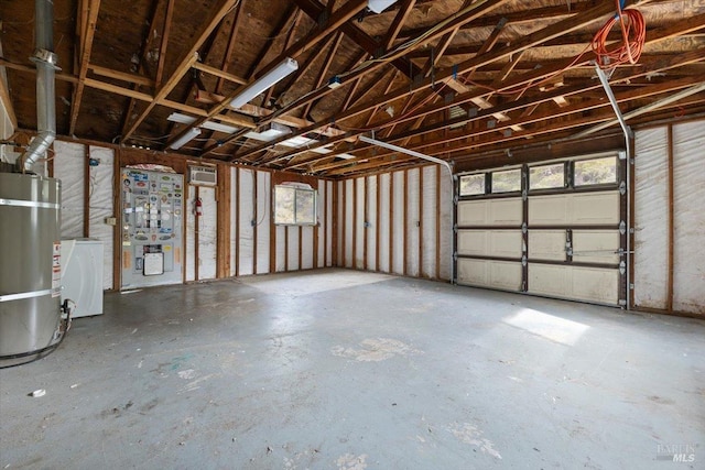 garage with washer / dryer and secured water heater