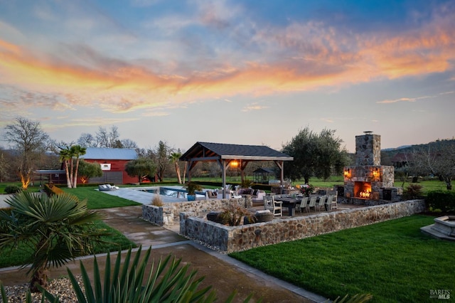 view of home's community featuring a gazebo, a lawn, a patio, and a pool