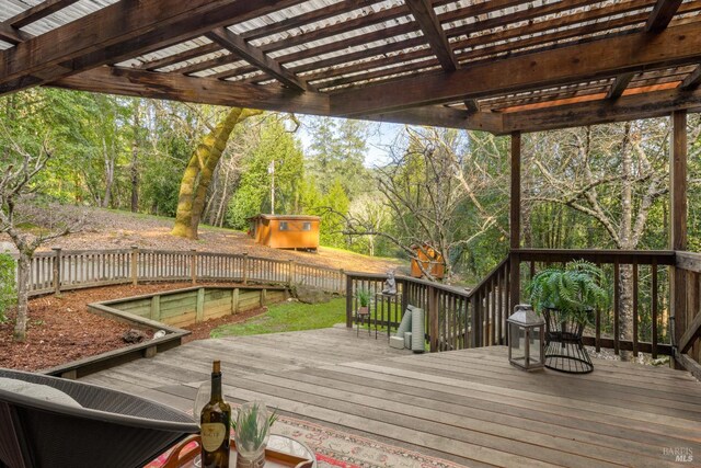 wooden deck with fence and a pergola