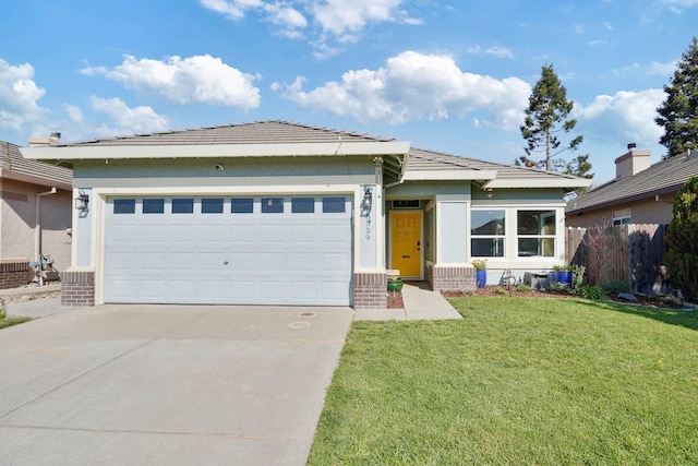 ranch-style house with a garage, driveway, fence, a front yard, and stucco siding