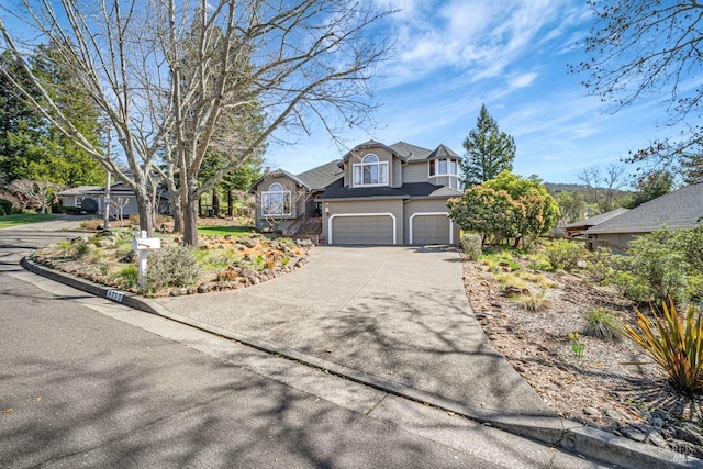 view of front of house featuring an attached garage and driveway