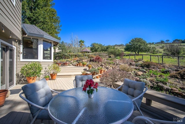 deck featuring outdoor dining area