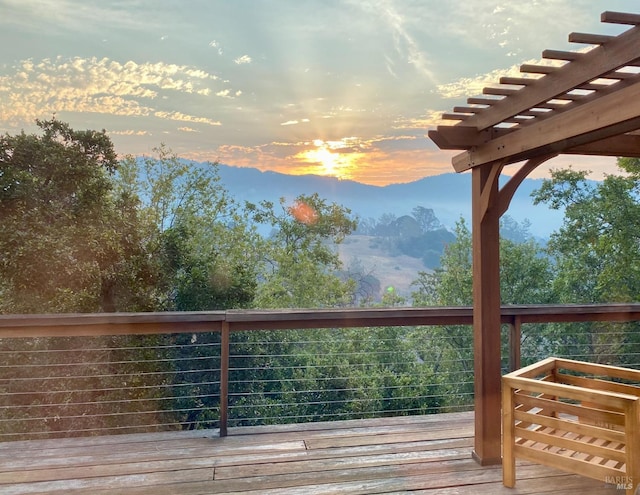 deck at dusk with a pergola