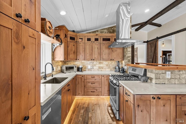 kitchen with lofted ceiling, a sink, island range hood, gas range, and dishwasher