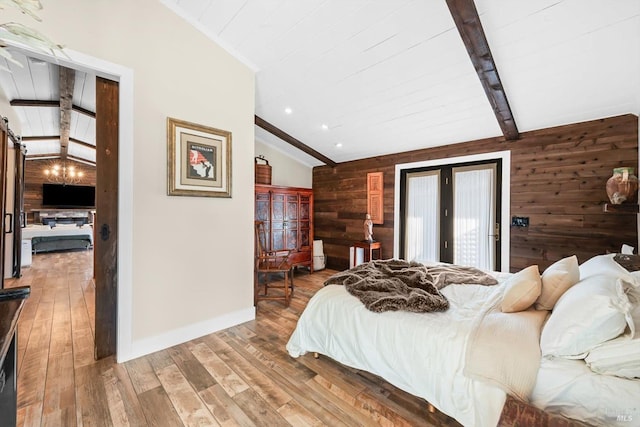 bedroom with lofted ceiling with beams, light wood finished floors, access to outside, and wooden walls