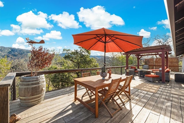 wooden terrace featuring outdoor dining space