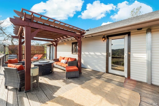 wooden deck featuring an outdoor living space with a fire pit and a pergola