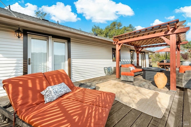 wooden deck with a pergola and an outdoor hangout area