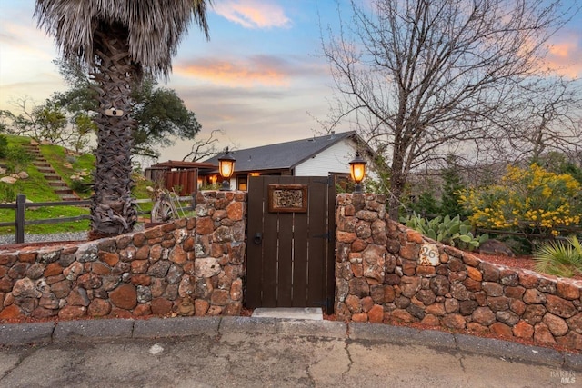 gate at dusk with fence