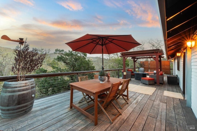 wooden terrace featuring outdoor dining area and an outdoor living space