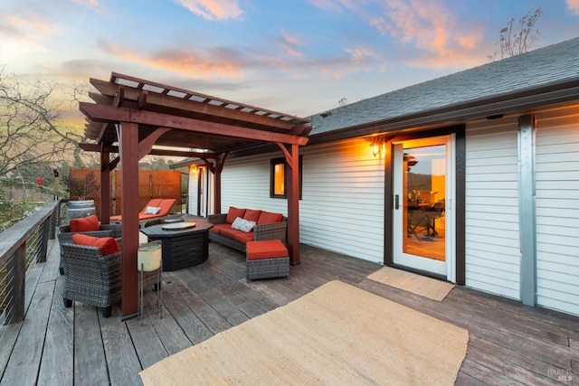 wooden deck with an outdoor hangout area and a pergola