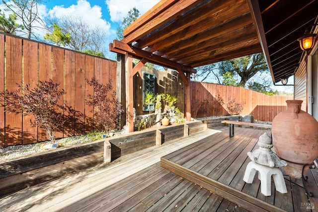 deck with a fenced backyard