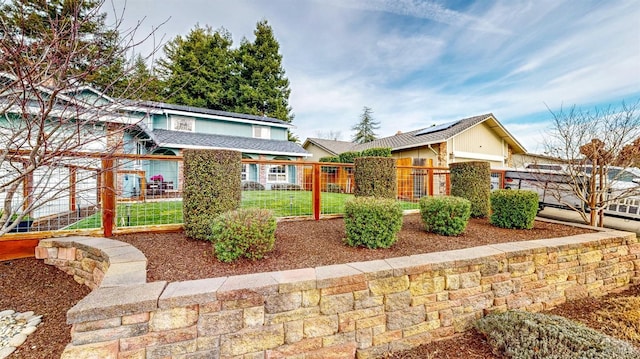 view of front of home with fence