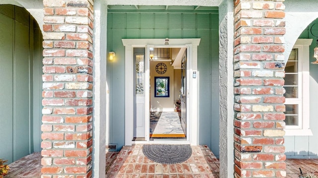 entrance to property with brick siding