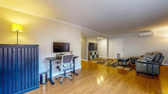 office area featuring baseboards, ornamental molding, wood finished floors, and an AC wall unit