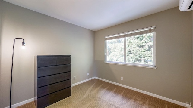 unfurnished bedroom featuring an AC wall unit, carpet flooring, vaulted ceiling, and baseboards