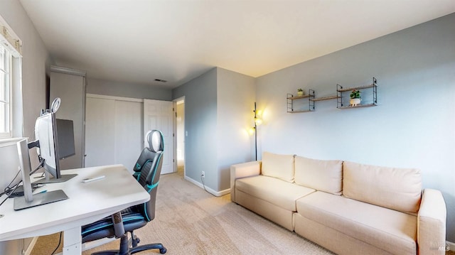 office area with light carpet, visible vents, and baseboards