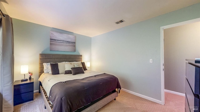 bedroom with light carpet, baseboards, and visible vents