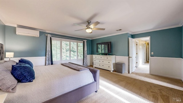 bedroom featuring a wainscoted wall, a wall mounted AC, light colored carpet, and crown molding