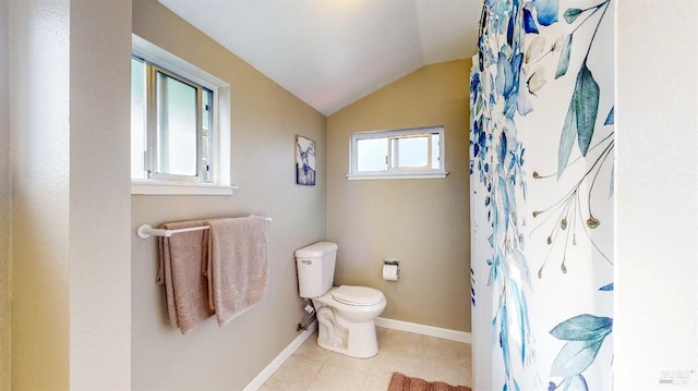 full bath with lofted ceiling, toilet, a shower with shower curtain, baseboards, and tile patterned floors