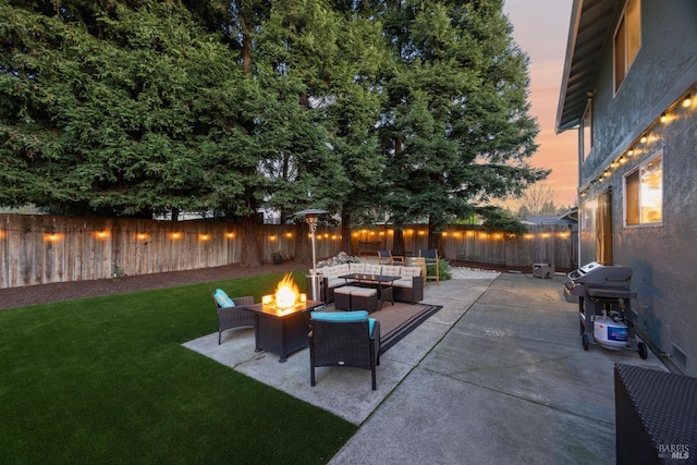 view of patio with a fenced backyard, a grill, and an outdoor living space with a fire pit