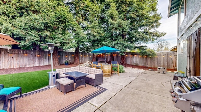 view of patio / terrace featuring a fenced backyard and outdoor lounge area