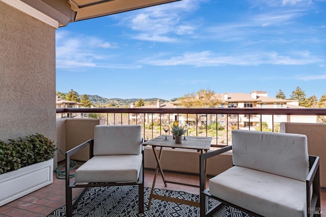 balcony featuring a mountain view