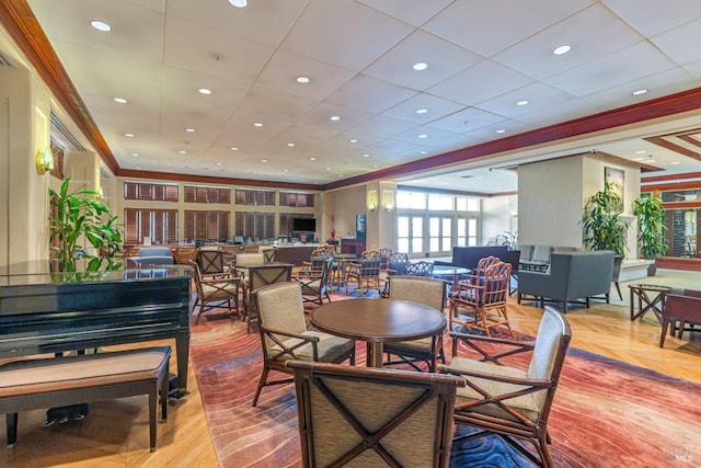 dining room with ornamental molding, parquet flooring, and recessed lighting