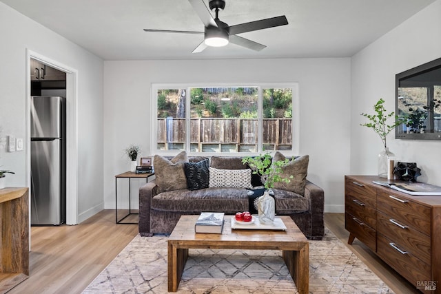 483 Rinconada Ct, Benicia, CA 94510 - living area with light wood-style flooring, ceiling fan, and baseboards