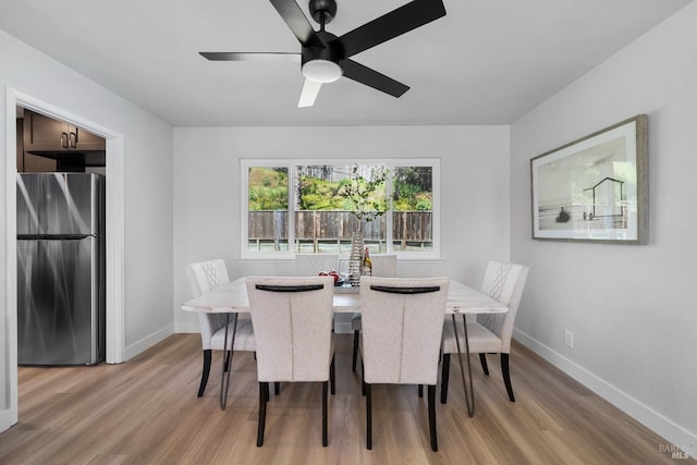 483 Rinconada Ct, Benicia, CA 94510 - dining area with light wood-style flooring, baseboards, and a ceiling fan