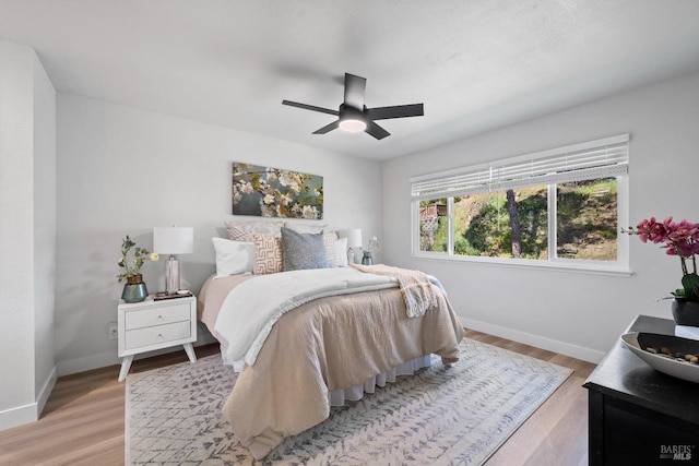 483 Rinconada Ct, Benicia, CA 94510 - bedroom featuring baseboards, light wood finished floors, and a ceiling fan