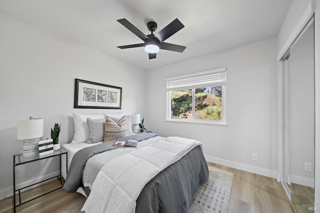 483 Rinconada Ct, Benicia, CA 94510 - bedroom with baseboards, light wood-style flooring, and a ceiling fan