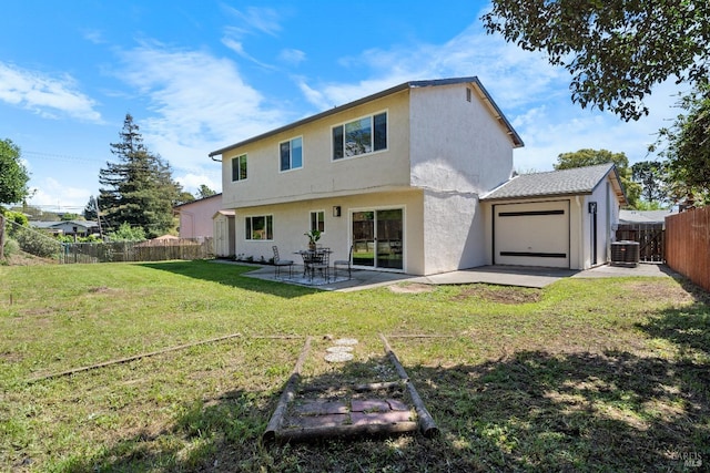 483 Rinconada Ct, Benicia, CA 94510 - rear view of property featuring central AC unit, a patio area, stucco siding, and a garage