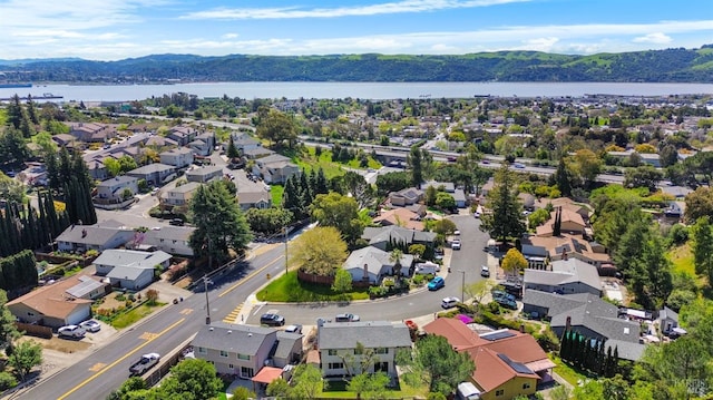 bird's eye view featuring a water and mountain view and a residential view