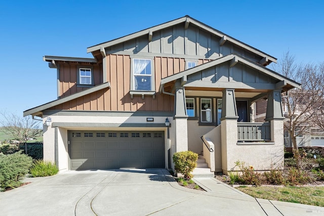 craftsman house featuring a garage, concrete driveway, and board and batten siding