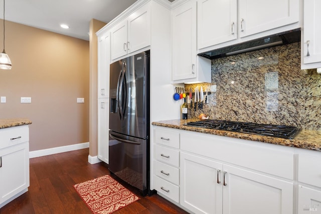 kitchen featuring gas cooktop, premium range hood, white cabinetry, fridge with ice dispenser, and decorative light fixtures