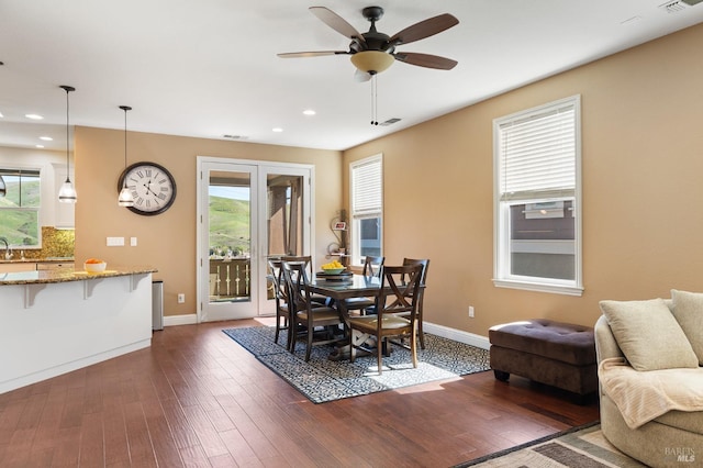 dining space featuring dark wood-style floors, recessed lighting, visible vents, and baseboards